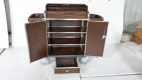 Dolphy housekeeping cart with doors and drawer open, showing the inner shelves