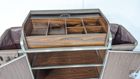 Top caddy compartments of the Dolphy wood-look housekeeping cart