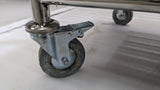 Close-up of a braked castor wheel on the Dolphy laundry cart