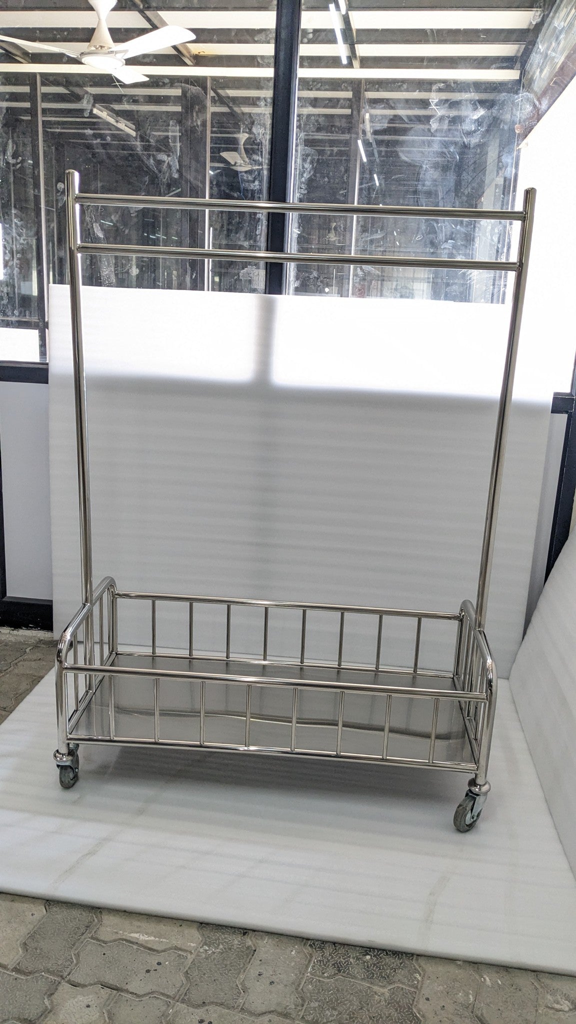 Dolphy stainless steel laundry cart with hanging bar and railed base, real photo
