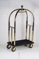 Dolphy gold and black luggage trolley at an angle