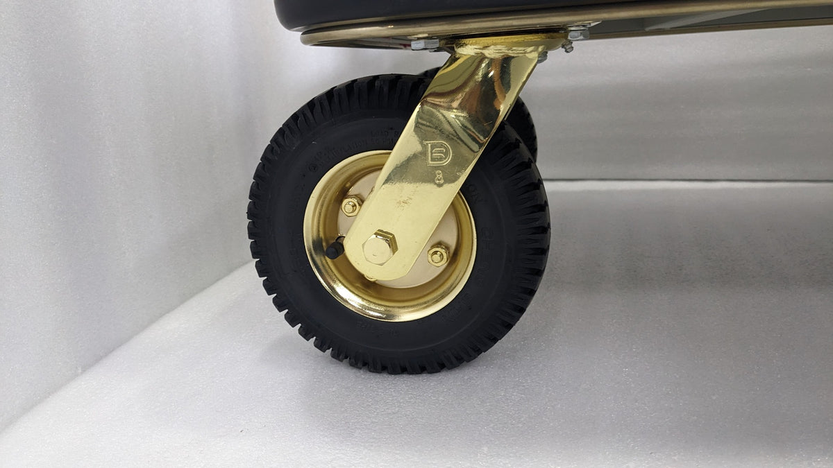 Close-up of a gold castor wheel on the Dolphy heavy-duty luggage trolley