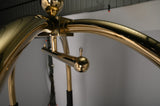 Close-up of the gold ball finial and hanging rail on the Dolphy luggage trolley