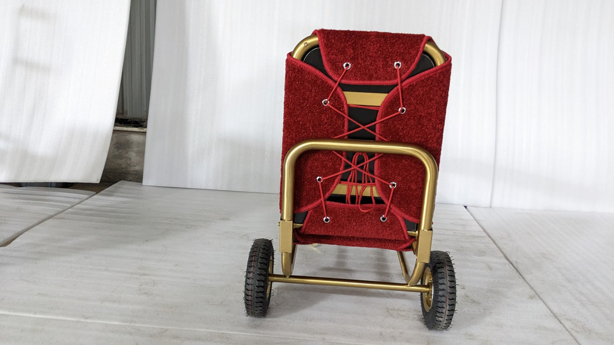 Back of the Dolphy gold luggage trolley showing the wheels and frame