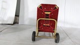 Back of the Dolphy gold luggage trolley showing the wheels and frame
