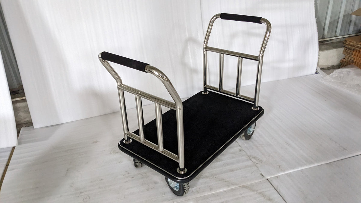 Dolphy platform luggage trolley with black carpeted deck and two chrome handles