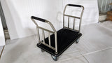 Dolphy platform luggage trolley with black carpeted deck and two chrome handles