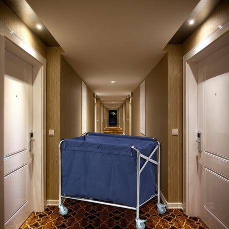 Dolphy foldable linen trolley with navy bag in a hotel corridor