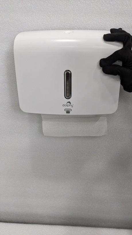 Dolphy white plaza paper towel dispenser mounted on a wall with a towel at the outlet