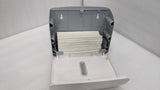 Dolphy white plaza dispenser opened and loaded with a stack of folded paper towels