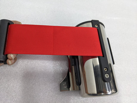 Red belt pulled out of the Dolphy stainless steel wall-mounted queue barrier