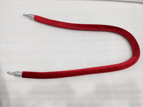 Dolphy red velvet queue barrier rope laid out full length with chrome ends