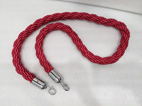 Red twisted nylon queue barrier rope with chrome snap-hook ends, real photo