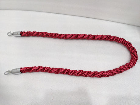 Red twisted queue barrier rope laid out full length