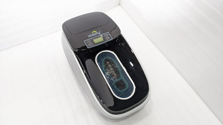Dolphy automatic shoe cover dispenser from above, showing the PRESS foot area