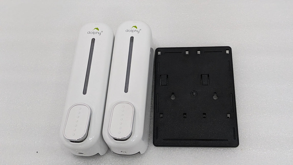 Dolphy white double soap dispenser beside its black wall-mount back plate