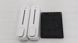 Dolphy white double soap dispenser beside its black wall-mount back plate