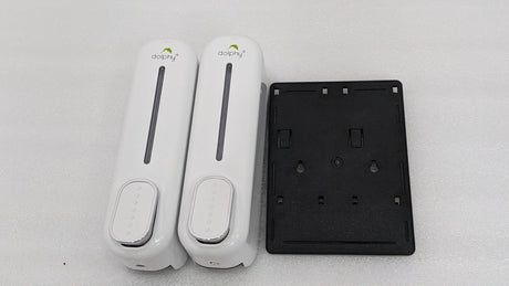 Dolphy white double soap dispenser beside its black wall-mount back plate