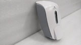 Dolphy white manual soap and sanitiser dispenser, side view with grey back plate