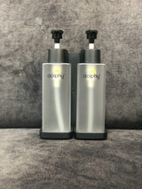 Two Dolphy clear 300ml pump soap dispensers in their black wall bracket