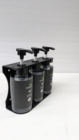 Dolphy triple pump dispenser in its bracket, side angle