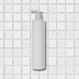 Dolphy white pump soap bottle shown against a white tiled wall