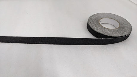 Roll of Dolphy black 25 mm anti-skid safety tape with a length unrolled