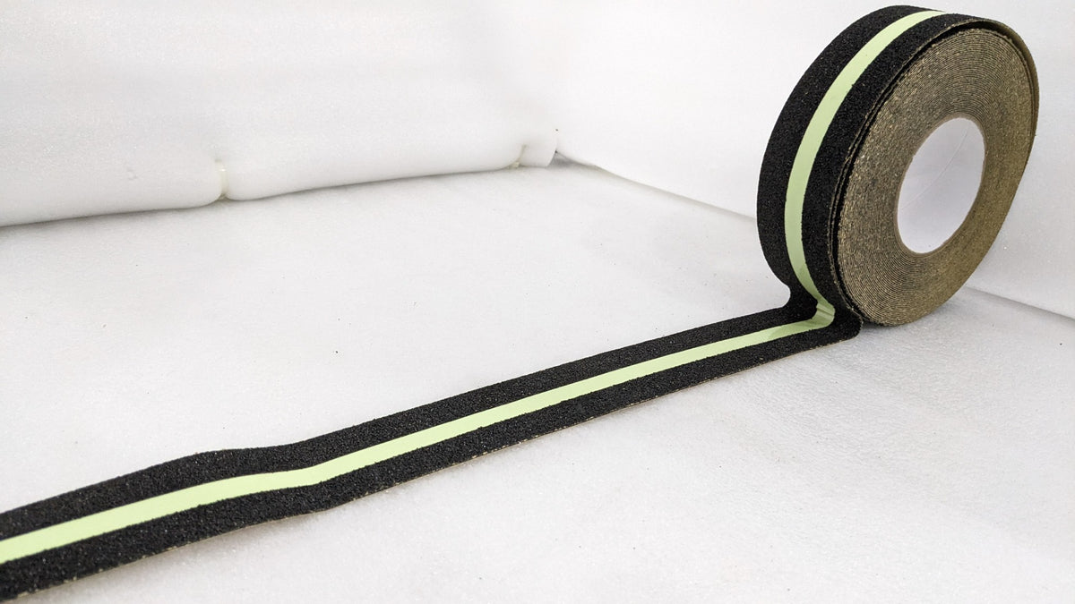 Roll of Dolphy black anti-skid tape with a glow-in-the-dark stripe, length unrolled