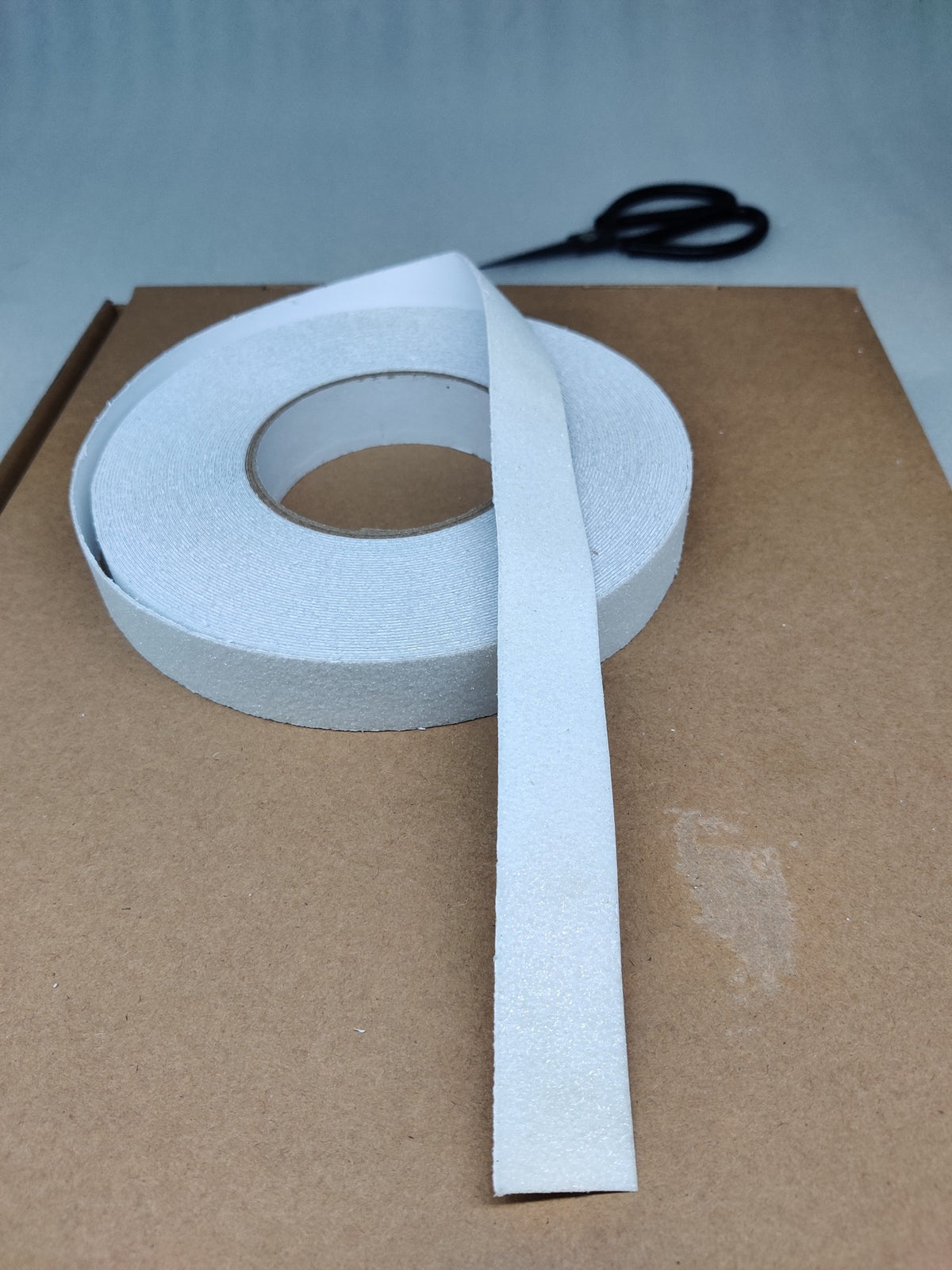 Roll of Dolphy transparent anti-skid safety tape with a length unrolled