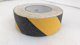 Dolphy black and yellow anti-skid tape roll, close-up of the gritty surface