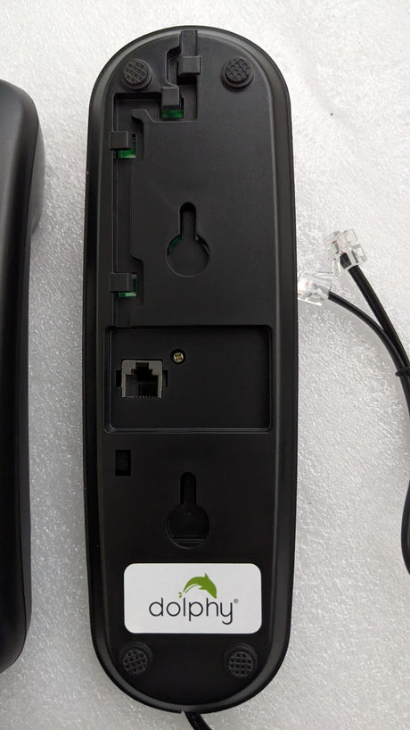 Back of the Dolphy telephone base showing keyhole wall-mount slots and the phone line socket