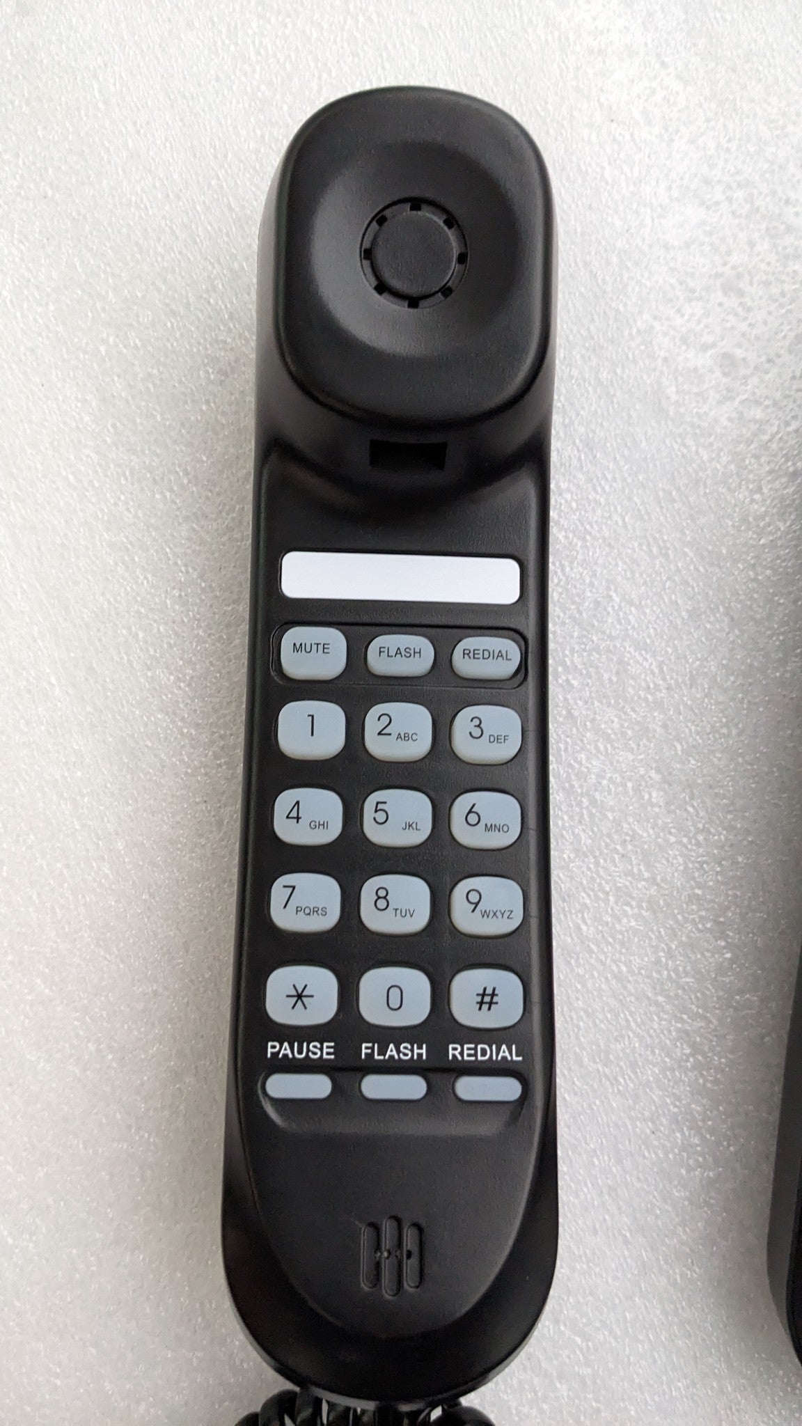 Dolphy black wall-mountable telephone handset keypad with mute, flash, redial and pause keys
