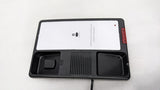 Dolphy black telephone base with the handset lifted, showing the cradle