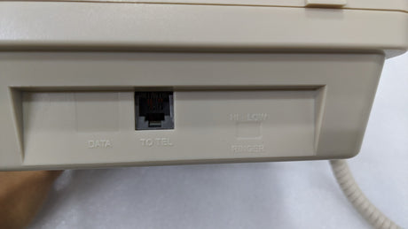 Line socket on the back of the Dolphy beige hotel telephone