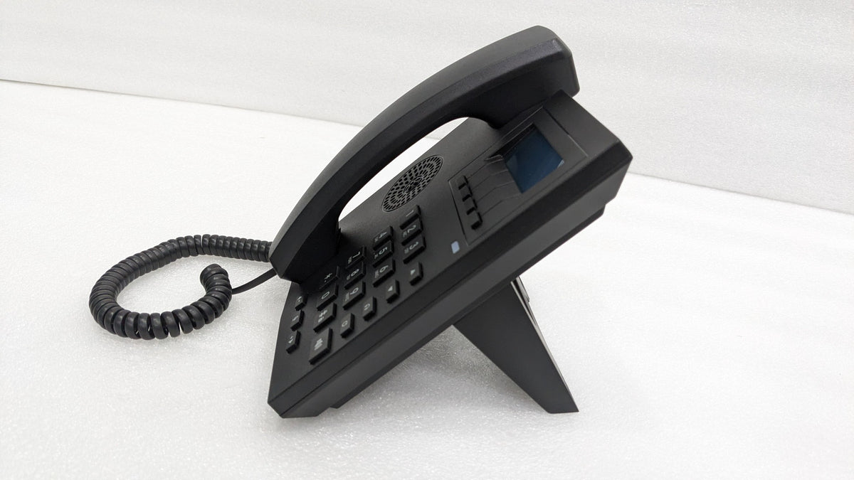 Dolphy corded telephone on its angled stand, side view