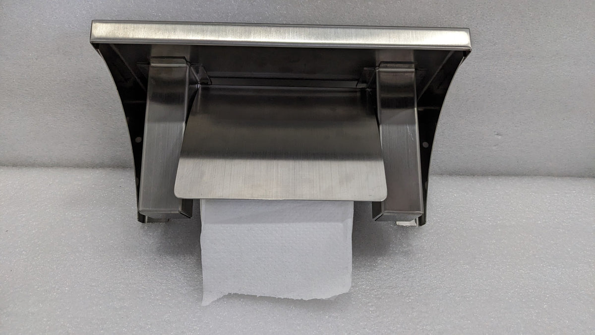 Underside of the Dolphy roll holder shelf showing the roll spindle and cover