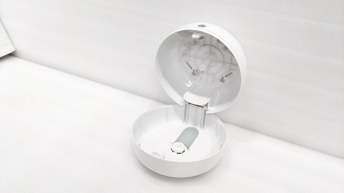 Dolphy centre-pull dispenser opened, showing the roll holder inside