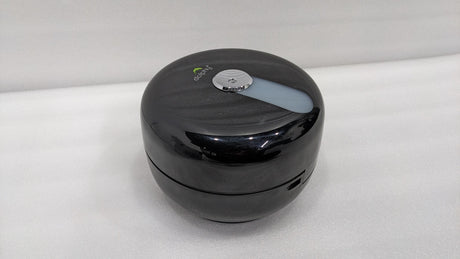 Dolphy black round centre-pull toilet paper dispenser, angled view