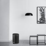 Dolphy 5L black pedal bin in a modern living room