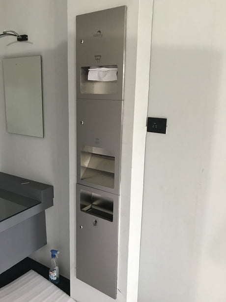 Dolphy recessed stainless steel washroom panel beside a basin, side view