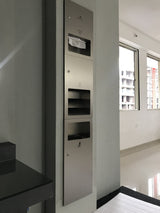Dolphy 3-in-1 recessed washroom panel installed in a wall: towel dispenser, hand dryer and bin