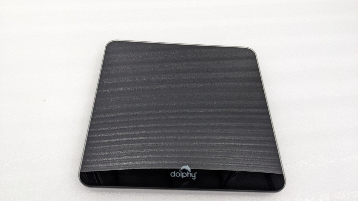 Dolphy black glass digital bathroom scale with textured top and Dolphy logo