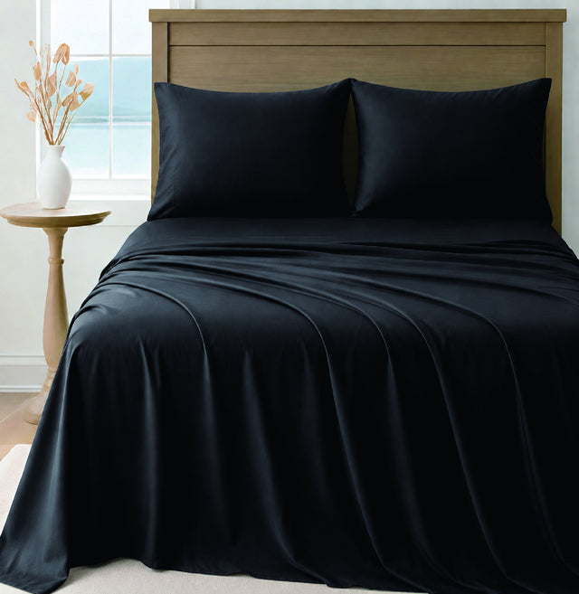 LinenCart black brushed microfibre sheet set on a made bed