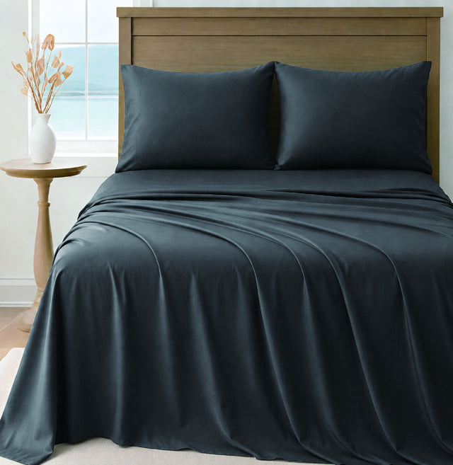 LinenCart charcoal brushed microfibre sheet set on a made bed