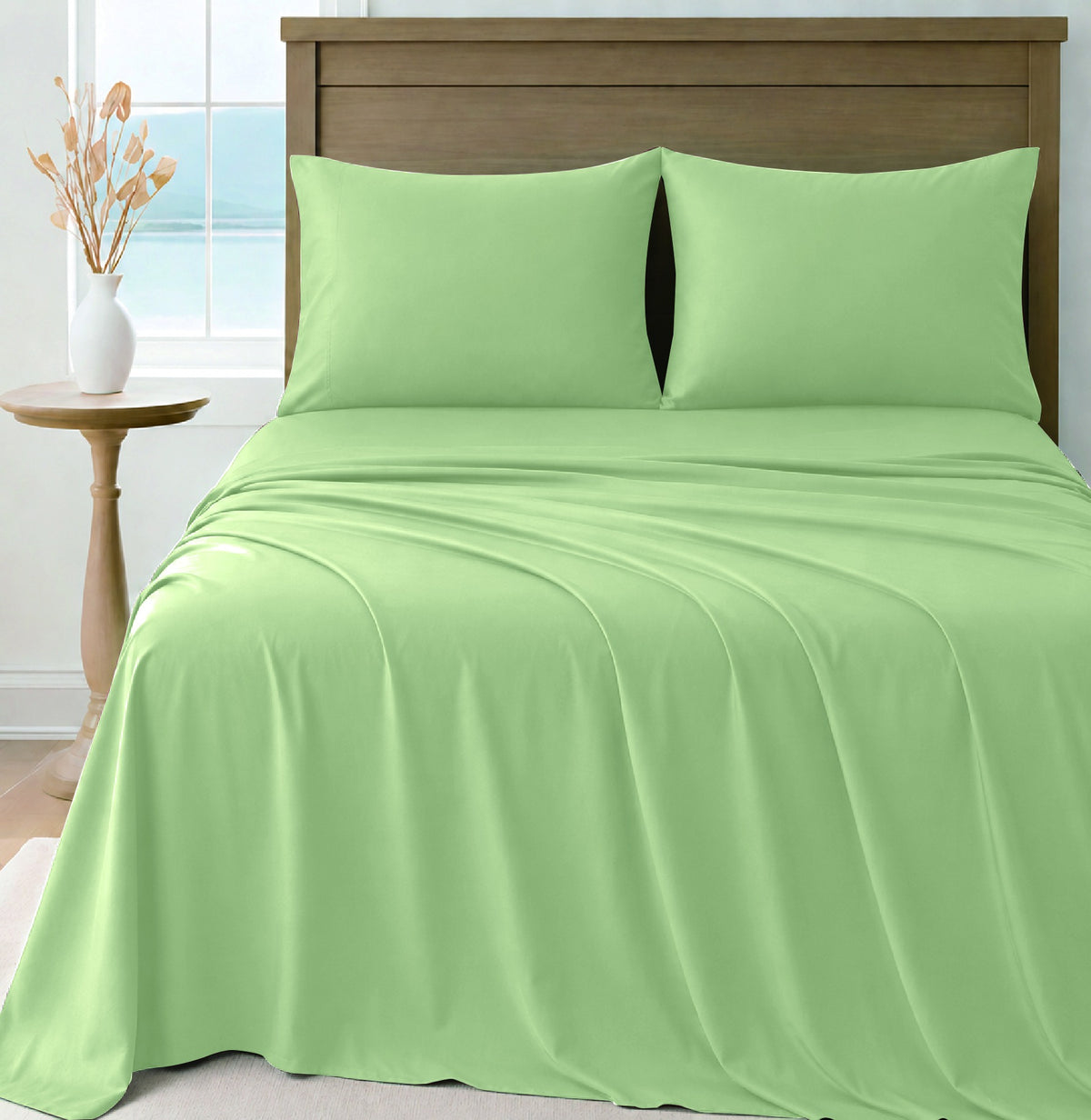 LinenCart green brushed microfibre sheet set on a made bed