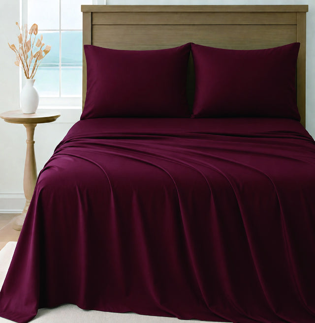 LinenCart maroon brushed microfibre sheet set on a made bed